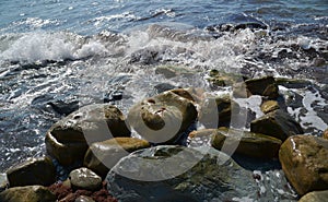 Sea waves lapping on rocky coast