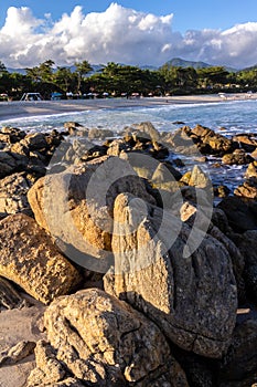 Sea waves lash line impact rock on the beach