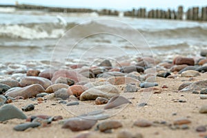 Sea waves lash line impact rock on the beach