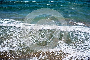 Sea waves near the beach in summer, southern Spain photo