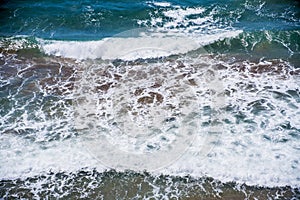 Sea waves near the beach in summer, southern Spain photo
