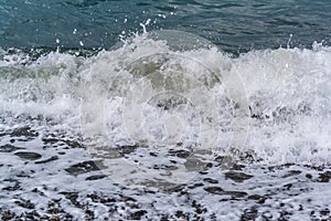 Sea waves on a pebbly shore