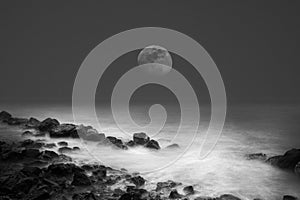 Sea waves rock and the moon