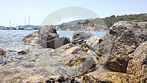Sea waves on rocky shore. Tourist destination at sea. Majorca Island