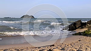 Sea waves run on the sandy shore in Samila beach at Songkhla