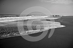 Sea waves on the sand on the lonely beach of Iloca.Chile.