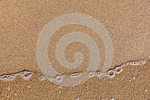 Sea waves on a sandy beach