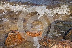 Sea waves splashing over rocks