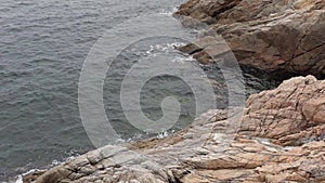 Sea waves splashing rocks, slow motion