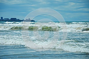 Sea waves. turquoise water. summer sea with a sandy shore. warm summer, sun, rest. background for the design.