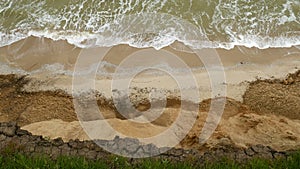 Sea with waves under the hills. Natural coast landscape. Mountain with ocean breze.