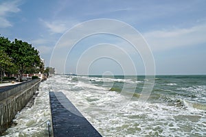 Sea waves white foam in summer