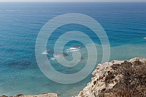 Sea waves on the wild rocky coast. Beautiful seascape. Travel concept. Seascape on the background of the wild rocky coast