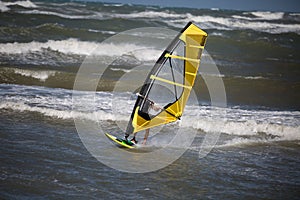 Sea Waves and Wind Surfing in the Summer in Windy Day