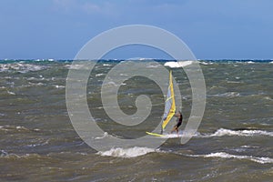 Sea Waves and Wind Surfing in the Summer in Windy Day