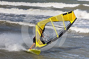 Sea Waves and Wind Surfing in the Summer in Windy Day