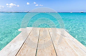 Sea wooden pier and transparent water