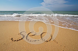 Sea word on the beach