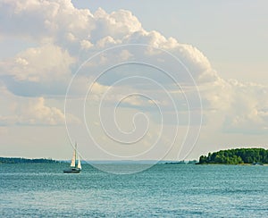 Sea, yacht and clouds. Summer Landscape