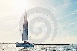 Sea, yacht and sailing on the ocean on vacation by summer sunshine on water. Lens flare, holiday adventure and boat