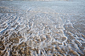 Seafoam on the beach