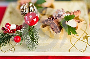 Seafood appetizer inside bread basket on Christmas table