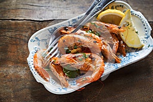 Seafood appetizer of spicy whole grilled prawns photo