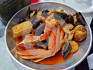 Seafood Boil crab legs shrimp and mussels photo