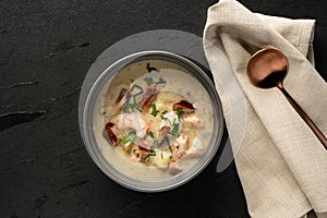 Seafood chowder with napkin and spoon