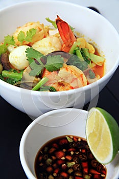 Seafood curry asian food in bowl, shrimp prawn with quail egg mixed with vegetables