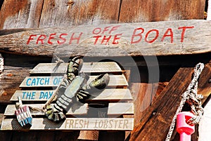 Seafood decor populate a wall of a seafood shack