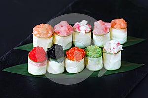 Seafood delicatessen, sushi rolls set on slate