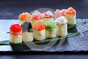 Seafood delicatessen, sushi rolls set on slate