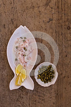 Seafood diet. Shrimps, lemon and capers