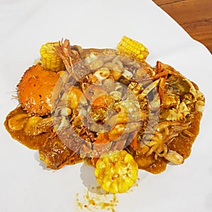 Seafood dishes consist of crab, shrimp, squid and corn