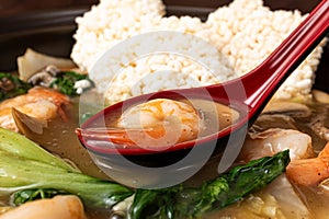 Seafood Fried Glutinous Rice Soup with Seafood and Vegetables and Fried Glutinous Rice