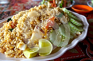 Seafood fried rice with cucumber and lemon