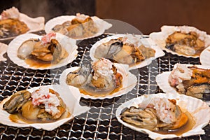 Seafood grill - street food in Tsukiji fish market, Tokyo, Japan