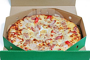 Seafood and ham pizza in paper box packaging