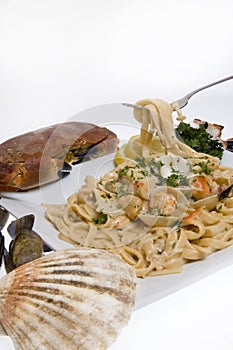 Seafood pasta against white