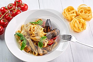 Seafood pasta fettuccine with mussels and basil. Spaghetti vongole - traditonal italian cuisine dish