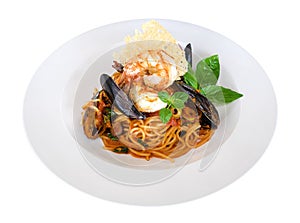 Seafood pasta spaghetti tomato sauce with prawns and mussel isolated on white background, path