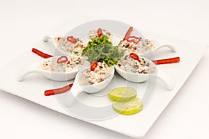 Seafood Peruvian dish: Pichanga de Mariscos. Ceviche style with white cream. photo