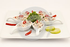 Seafood Peruvian dish: Pichanga de Mariscos. Ceviche style with white cream.