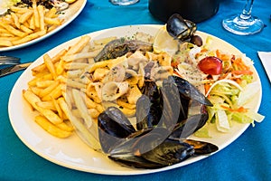 Seafood platter with fries