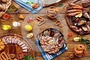 Seafood platter top view, flat lay on wooden table background