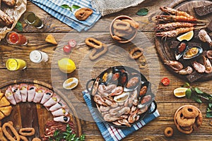 Seafood platter top view, flat lay on wooden table background