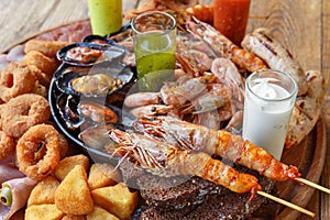 Seafood platter on wooden table background