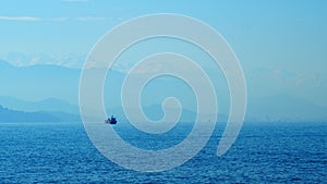 Seafood Production In The Sea Or Ocean. Fishing Boat Sails In The Open Sea. Real time.