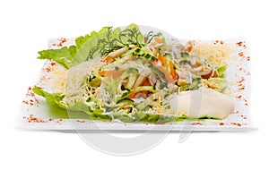 Seafood salad with squid and fresh vegetable, isolated on white